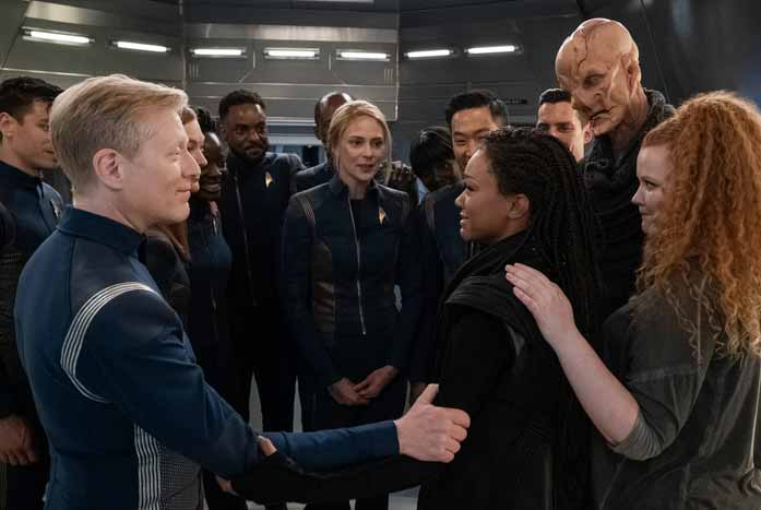 The crew welcomes Michael back. Courtesy of CBS